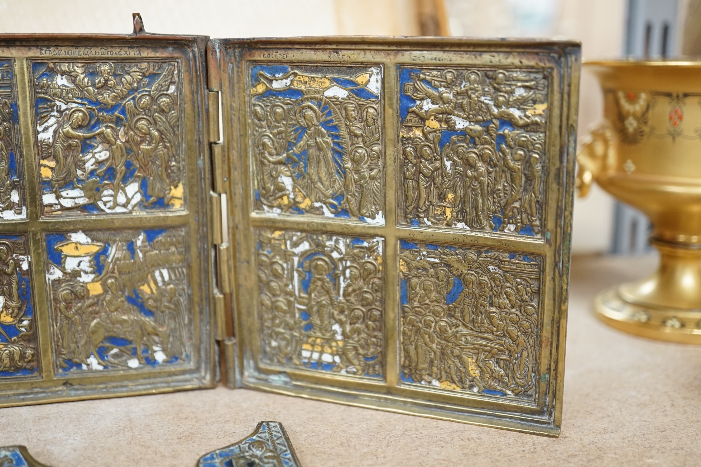 Two Russian Orthodox Church bronze and enamel triptych icons, largest 11cm high. Condition - fair